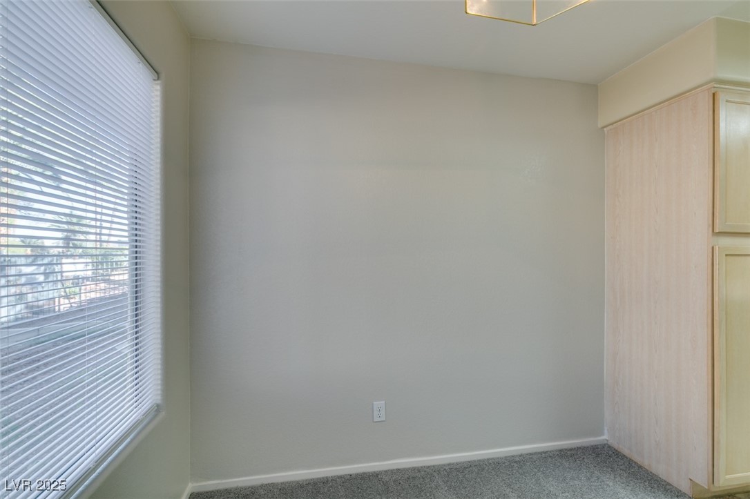 5211 Caspian Springs Drive, Unit 101 Las Vegas, NV 89120 - Photo 19 of 37 Unfurnished bedroom with carpet floors