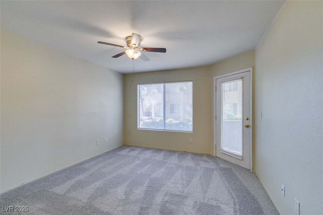5211 Caspian Springs Drive, Unit 101 Las Vegas, NV 89120 - Photo 28 of 37 Carpeted spare room featuring baseboards and a ceiling fan