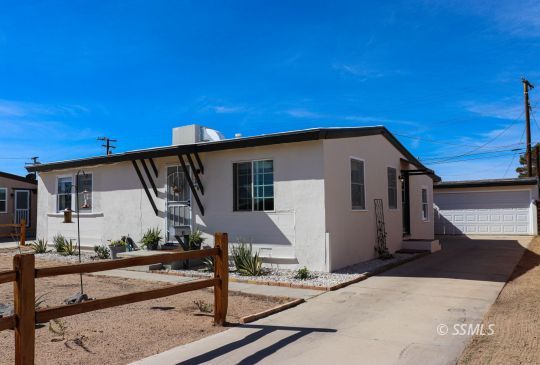 313 North Florence Street Ridgecrest, CA 93555 - Photo 38 of 38 a front view of a house with garage