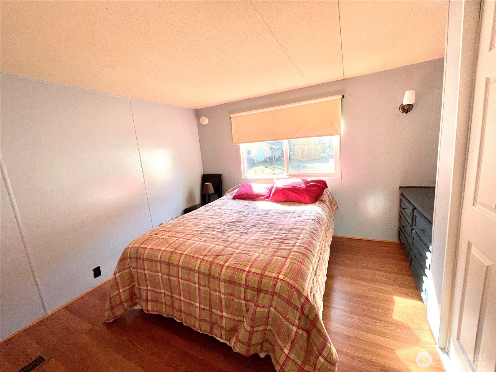 55 Paradise Lane Pacific Beach, WA 98571 - Photo 13 of 36 a bedroom with a bed and a window