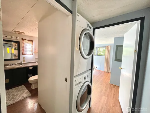 a view of a hallway with washer and dryer