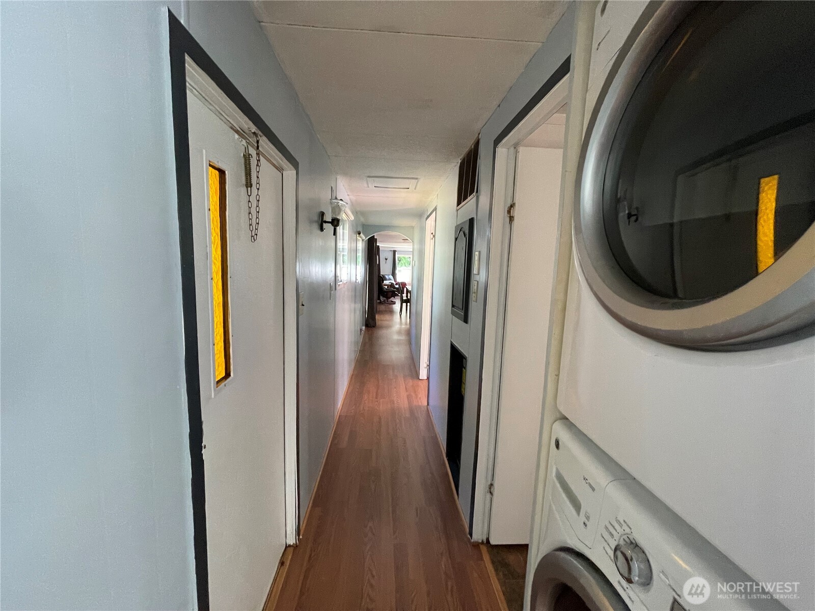 55 Paradise Lane Pacific Beach, WA 98571 - Photo 21 of 36 a view of a hallway with wooden floor and staircase