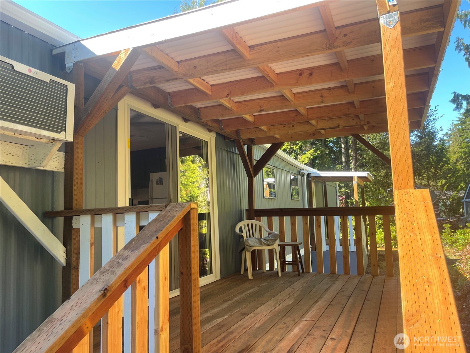 55 Paradise Lane Pacific Beach, WA 98571 - Photo 26 of 36 a view of a house with wooden deck and furniture