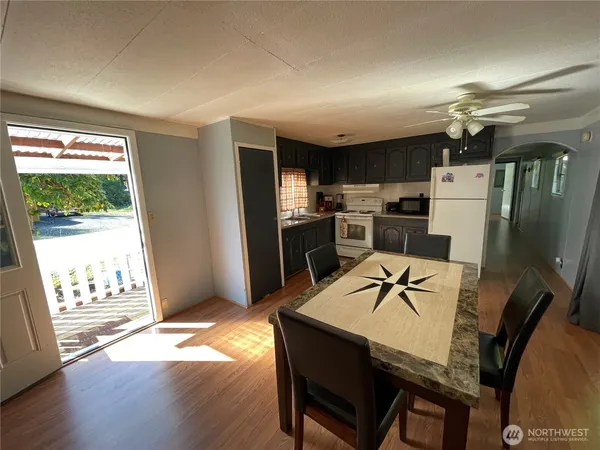 a view of a dining room with furniture window and wooden floor
