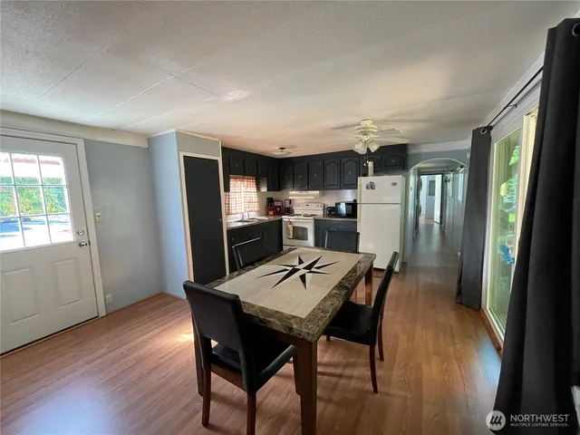 a kitchen with a table and chairs in it