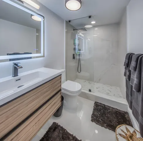 a spacious bedroom with a bed and a cabinets