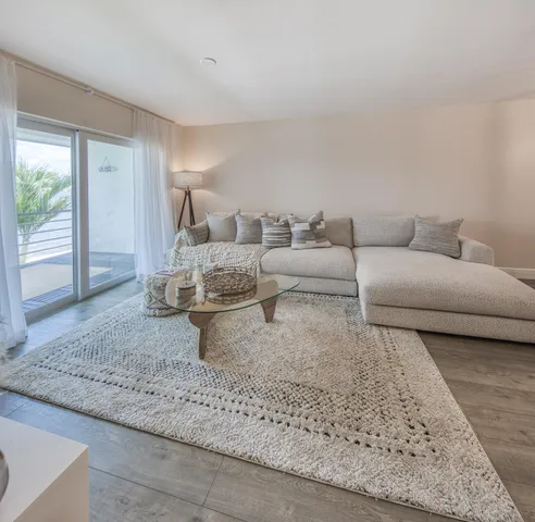 a kitchen with a refrigerator a stove top oven a sink dishwasher and wooden cabinets