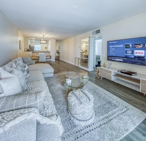 a living room with furniture and a rug