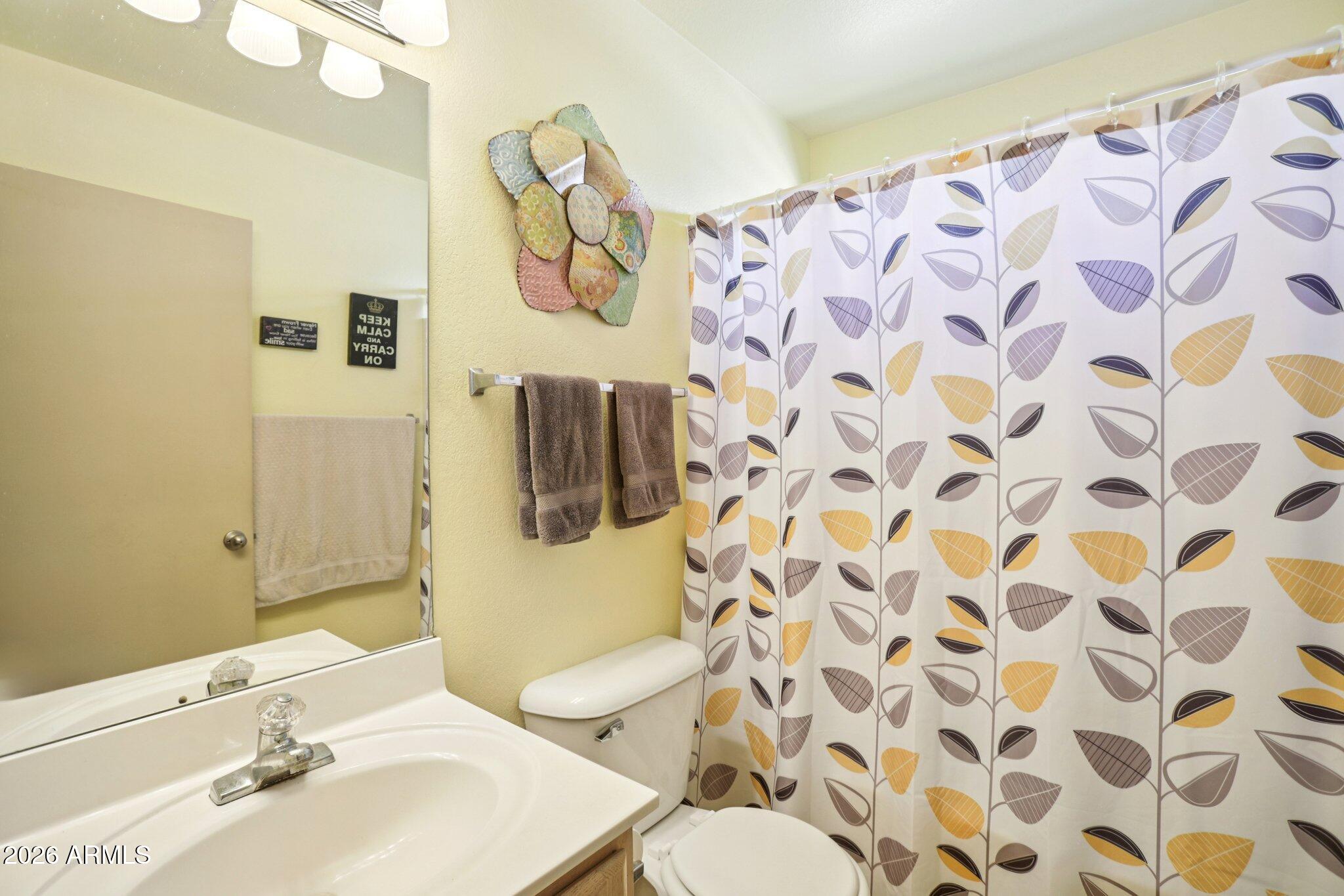 13414 South 47th Way Phoenix, AZ 85044 - Photo 17 of 32 a bathroom with a sink and a mirror