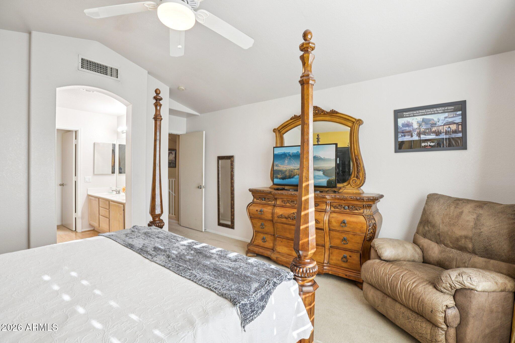 13414 South 47th Way Phoenix, AZ 85044 - Photo 20 of 32 a bedroom with a bed a couch and dresser