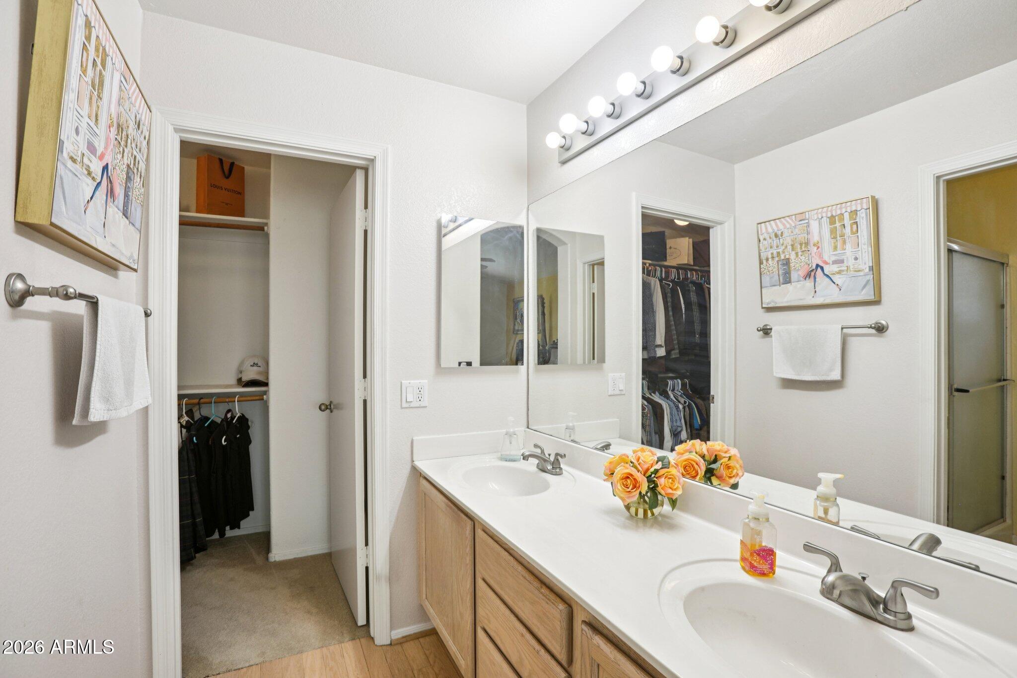 13414 South 47th Way Phoenix, AZ 85044 - Photo 21 of 32 a bathroom with a sink double vanity and a mirror