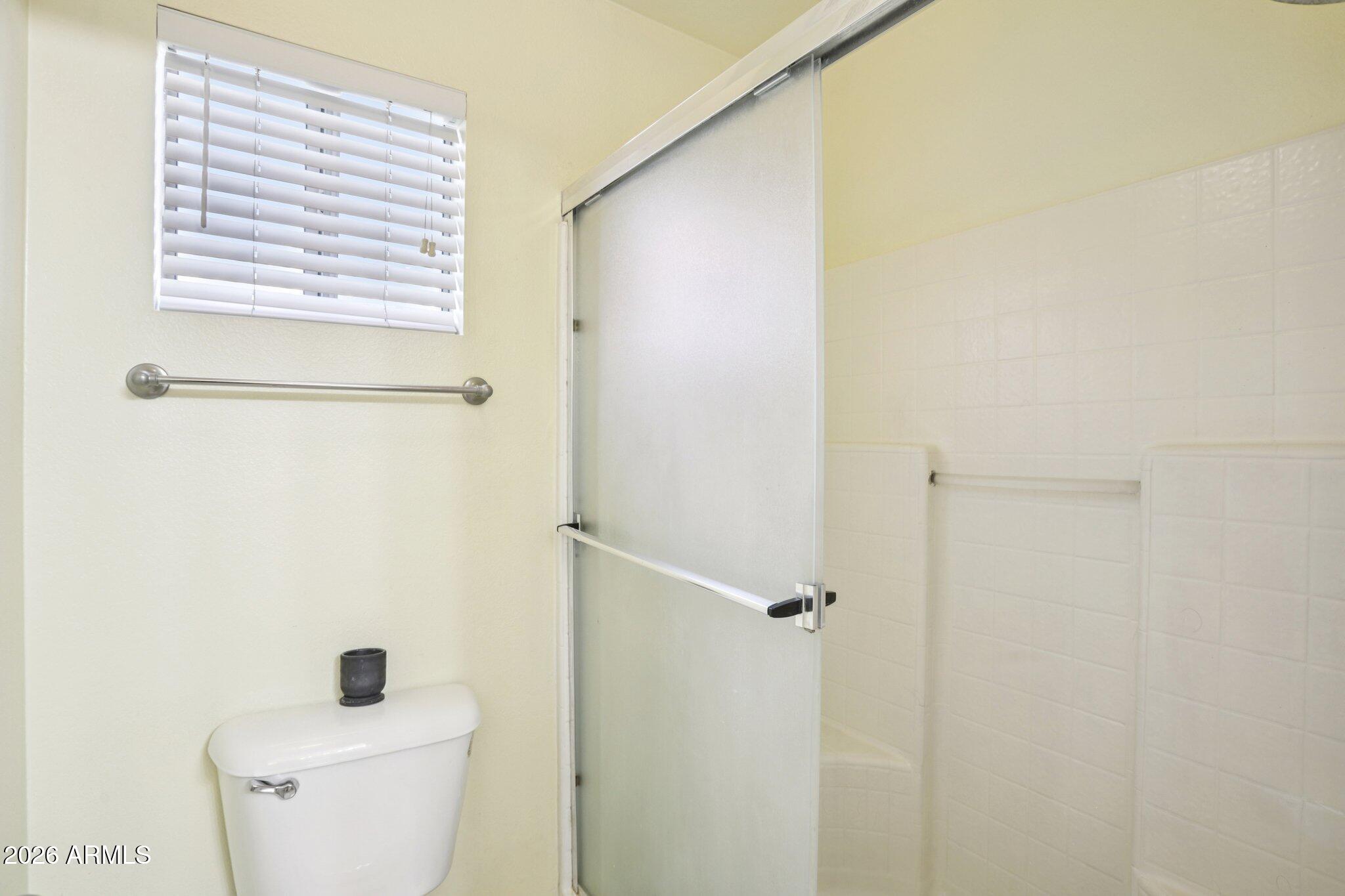 13414 South 47th Way Phoenix, AZ 85044 - Photo 22 of 32 a bathroom with a toilet and a shower