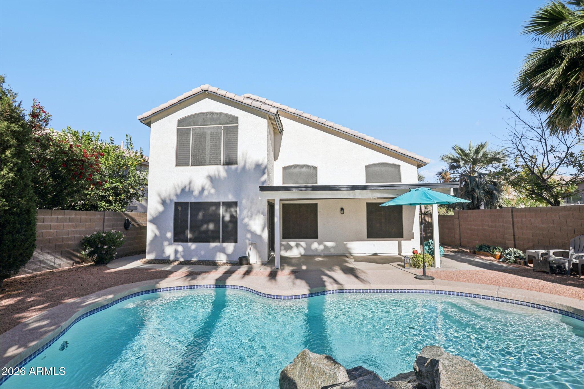 13414 South 47th Way Phoenix, AZ 85044 - Photo 27 of 32 a view of a house with a backyard and a patio