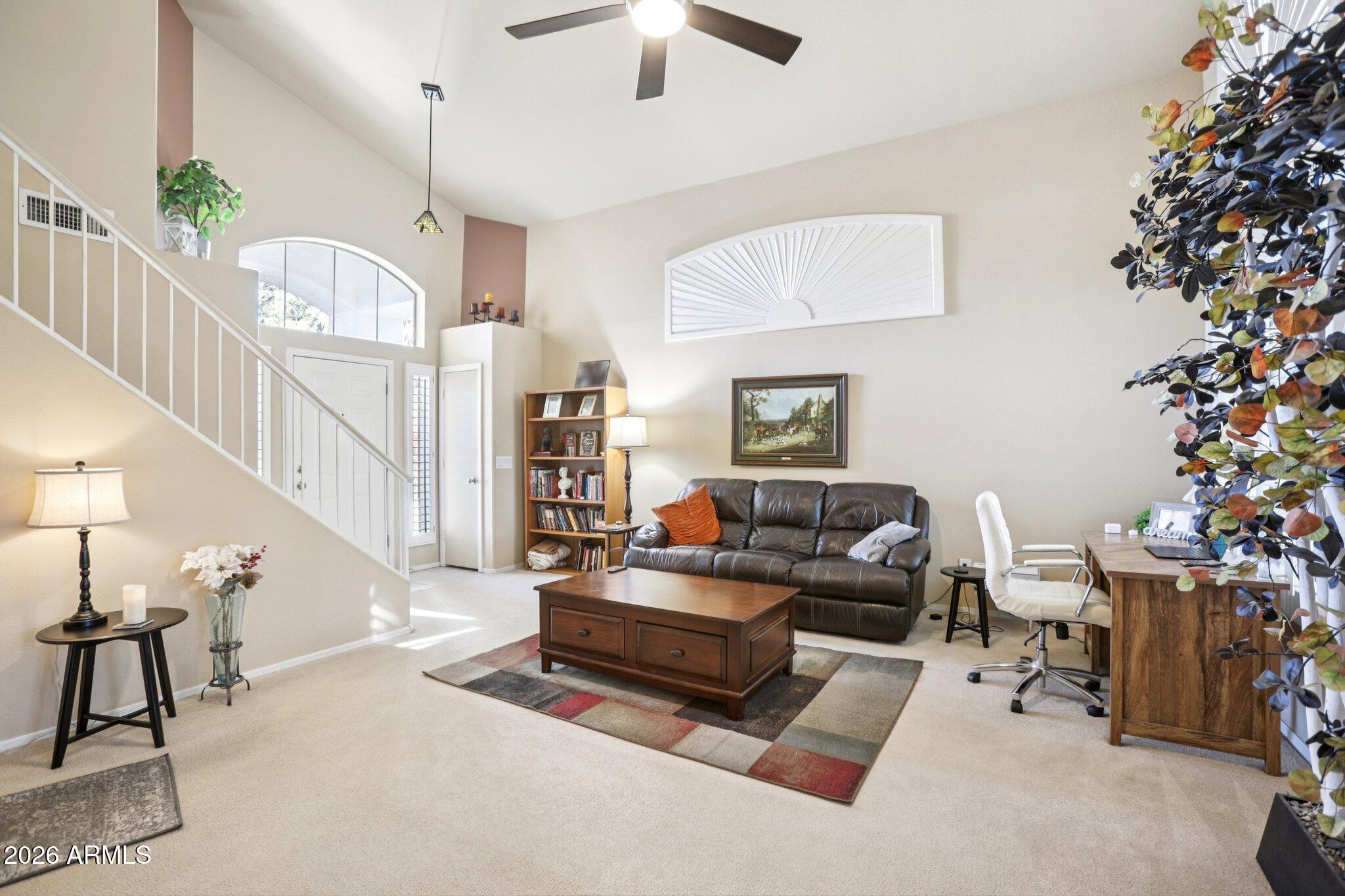 13414 South 47th Way Phoenix, AZ 85044 - Photo 5 of 32 a living room with furniture and a potted plant