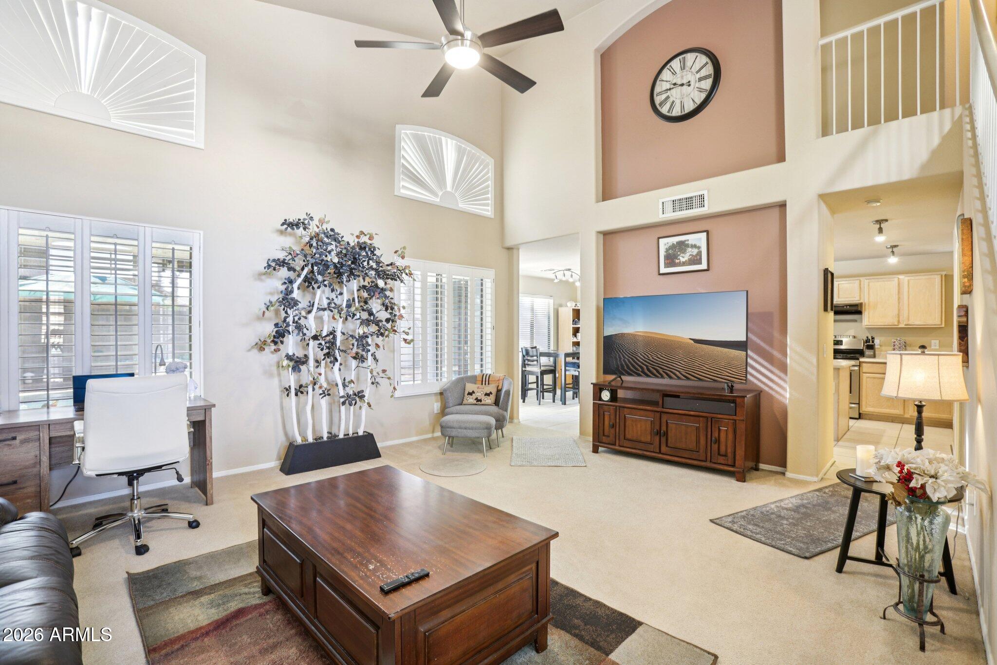 13414 South 47th Way Phoenix, AZ 85044 - Photo 7 of 32 a living room with furniture and a flat screen tv