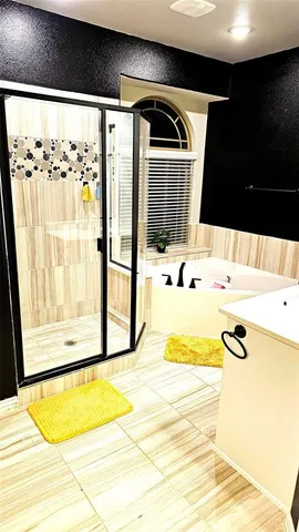 a kitchen with kitchen island granite countertop a stove and a sink