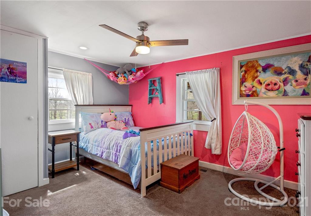 247 Jones Road Leicester, NC 28748 - Photo 22 of 41 a bedroom with a bed and window