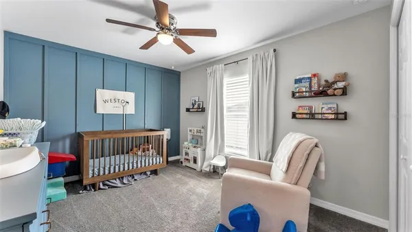 a bedroom with furniture and a window