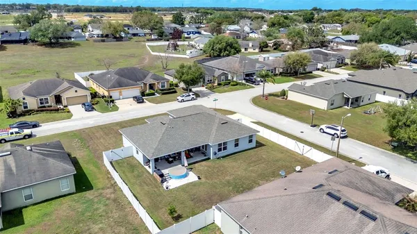 an aerial view of a house with outdoor space
