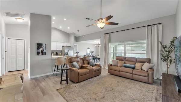 a living room with furniture and a large window