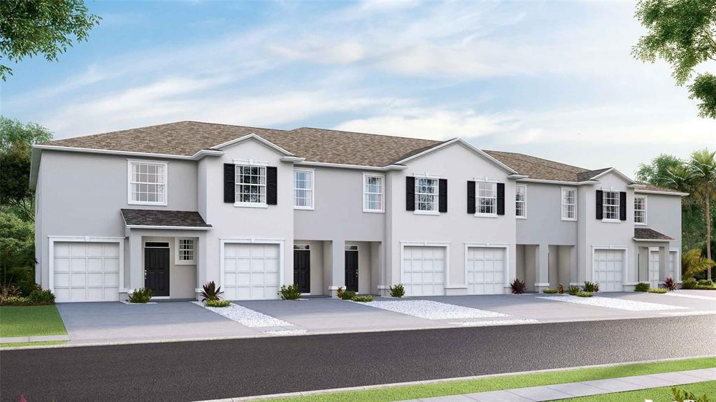 32463 Welling Blade Loop Wesley Chapel, FL 33545 - Photo 42 of 42 a front view of a house with a yard and garage