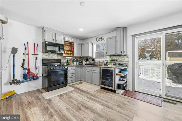 a kitchen with stainless steel appliances a stove and a refrigerator