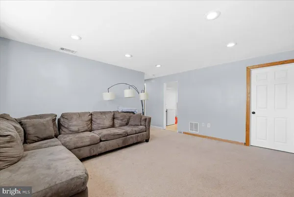 a living room with furniture and a couch