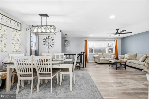 a view of a livingroom with furniture window and wooden floor