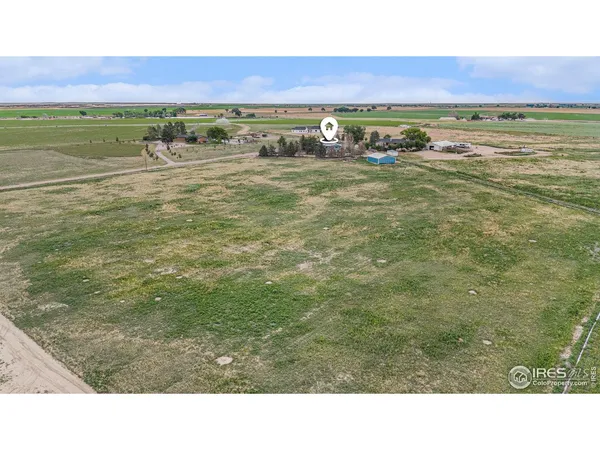 a aerial view of a house with a yard