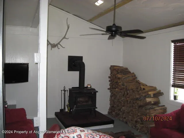 a living room with a couch and a flat screen tv