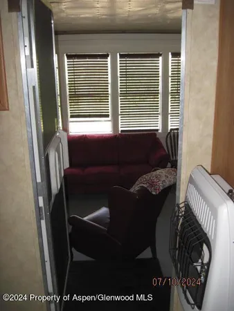 a balcony with furniture and a window