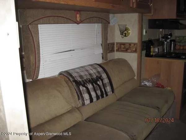 a bedroom with a bed and a mirror