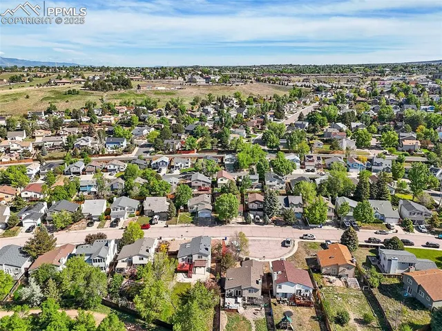 an aerial view of a city with lots of residential buildings