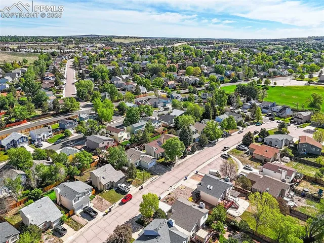 an aerial view of a city with lots of residential buildings