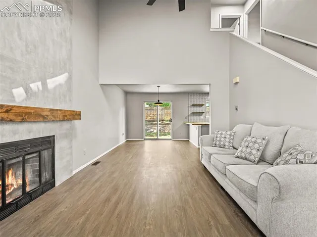 a living room with furniture and a fireplace