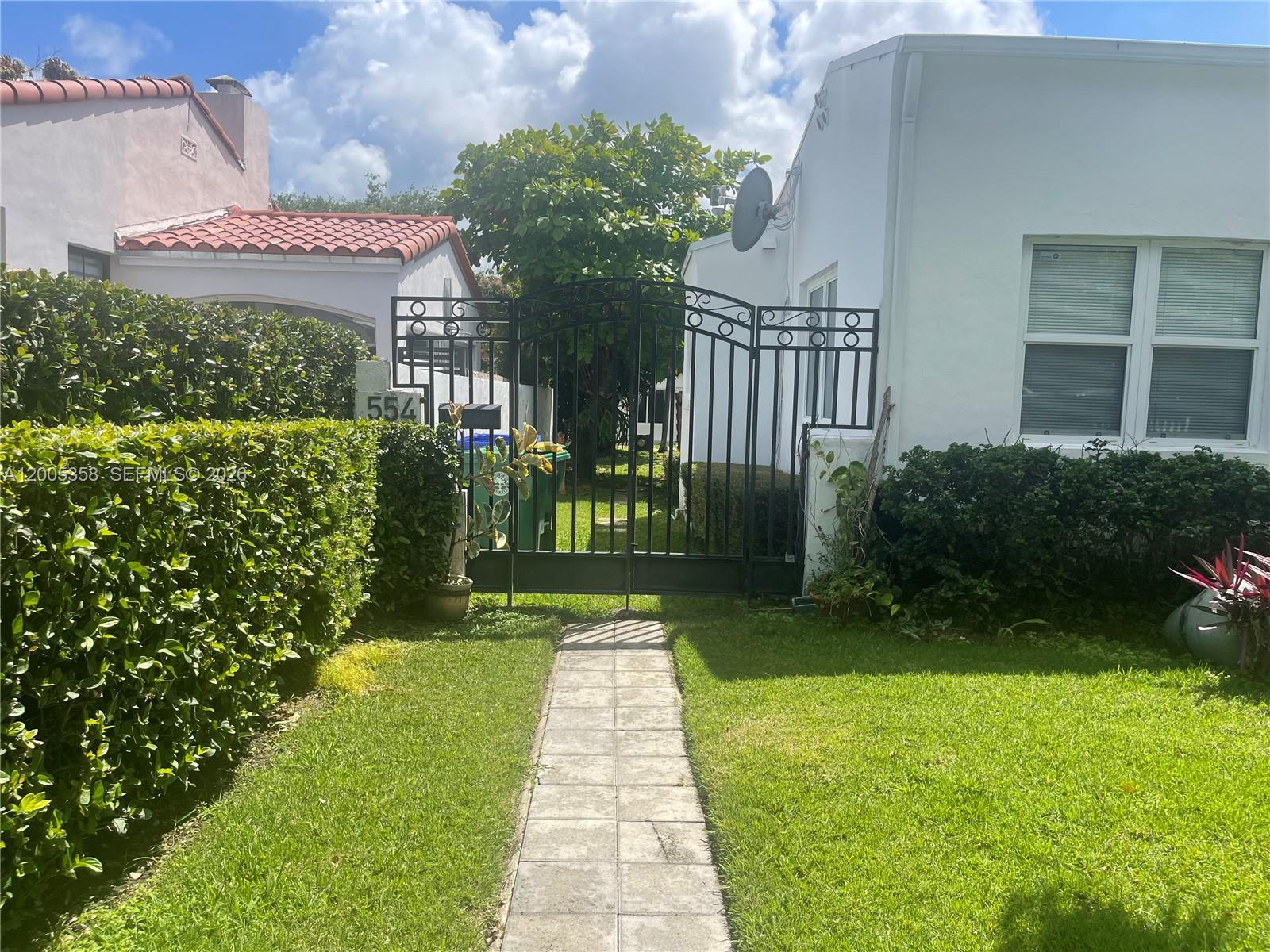 554 Northeast 74th Street, Unit 2 Miami, FL 33138 - Photo 2 of 30 a view of a back yard