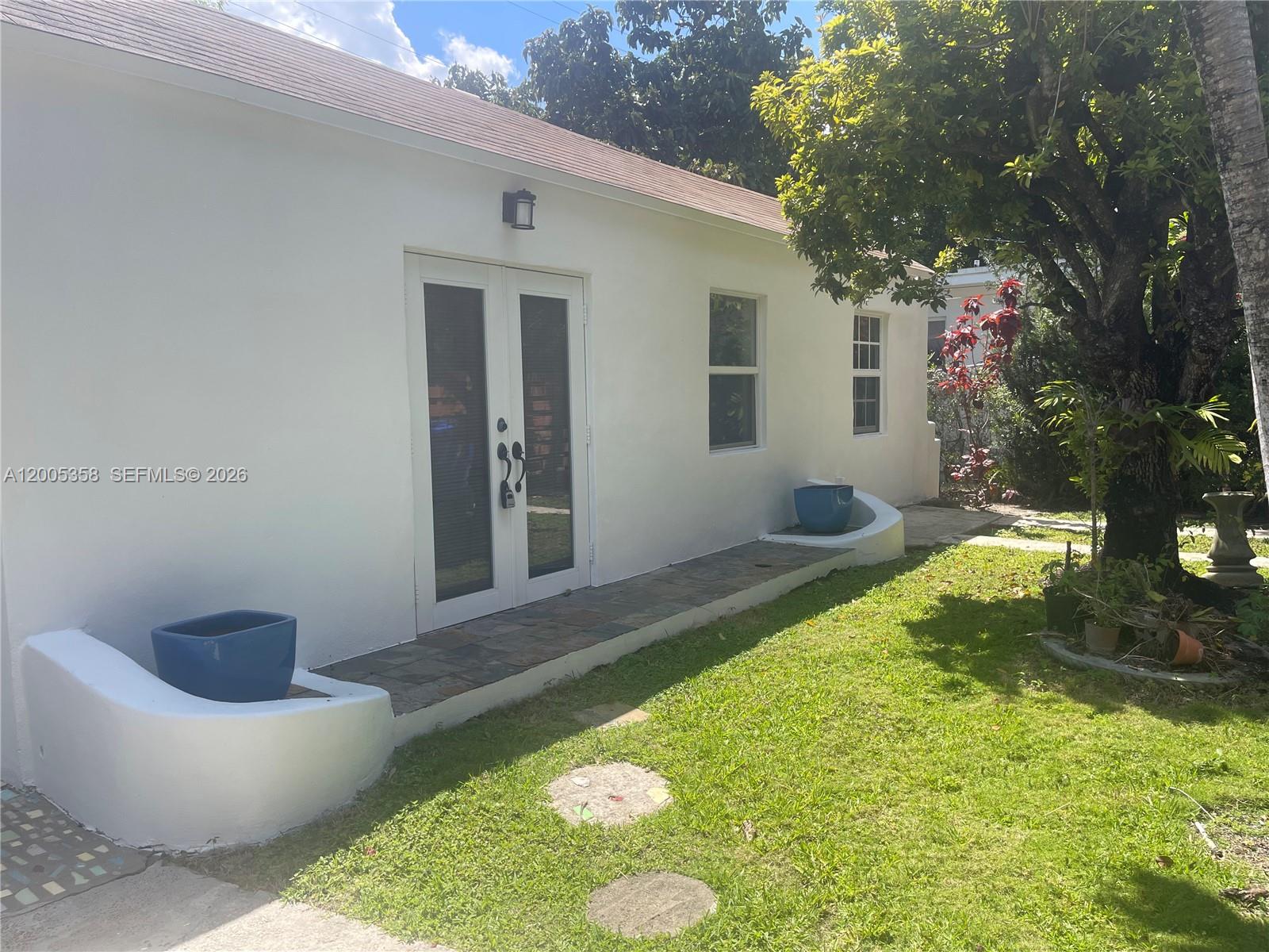 554 Northeast 74th Street, Unit 2 Miami, FL 33138 - Photo 29 of 30 a view of a back yard of the house