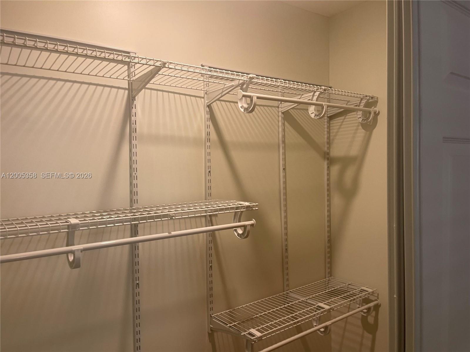 554 Northeast 74th Street, Unit 2 Miami, FL 33138 - Photo 9 of 30 a view of a room with rack on the wall