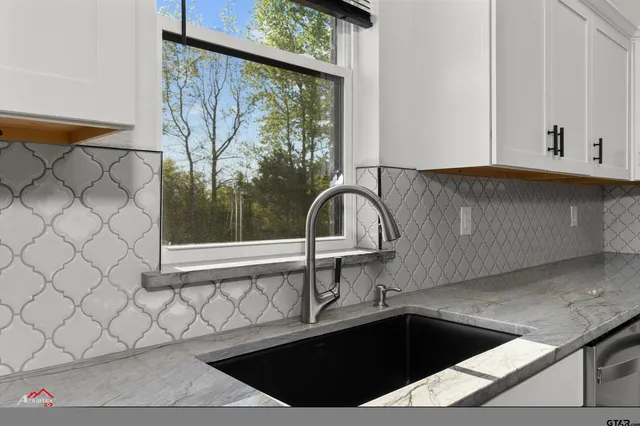 a kitchen with a sink and a window