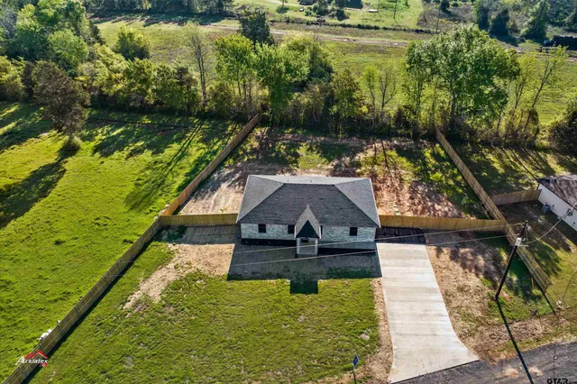 a view of swimming pool with a yard