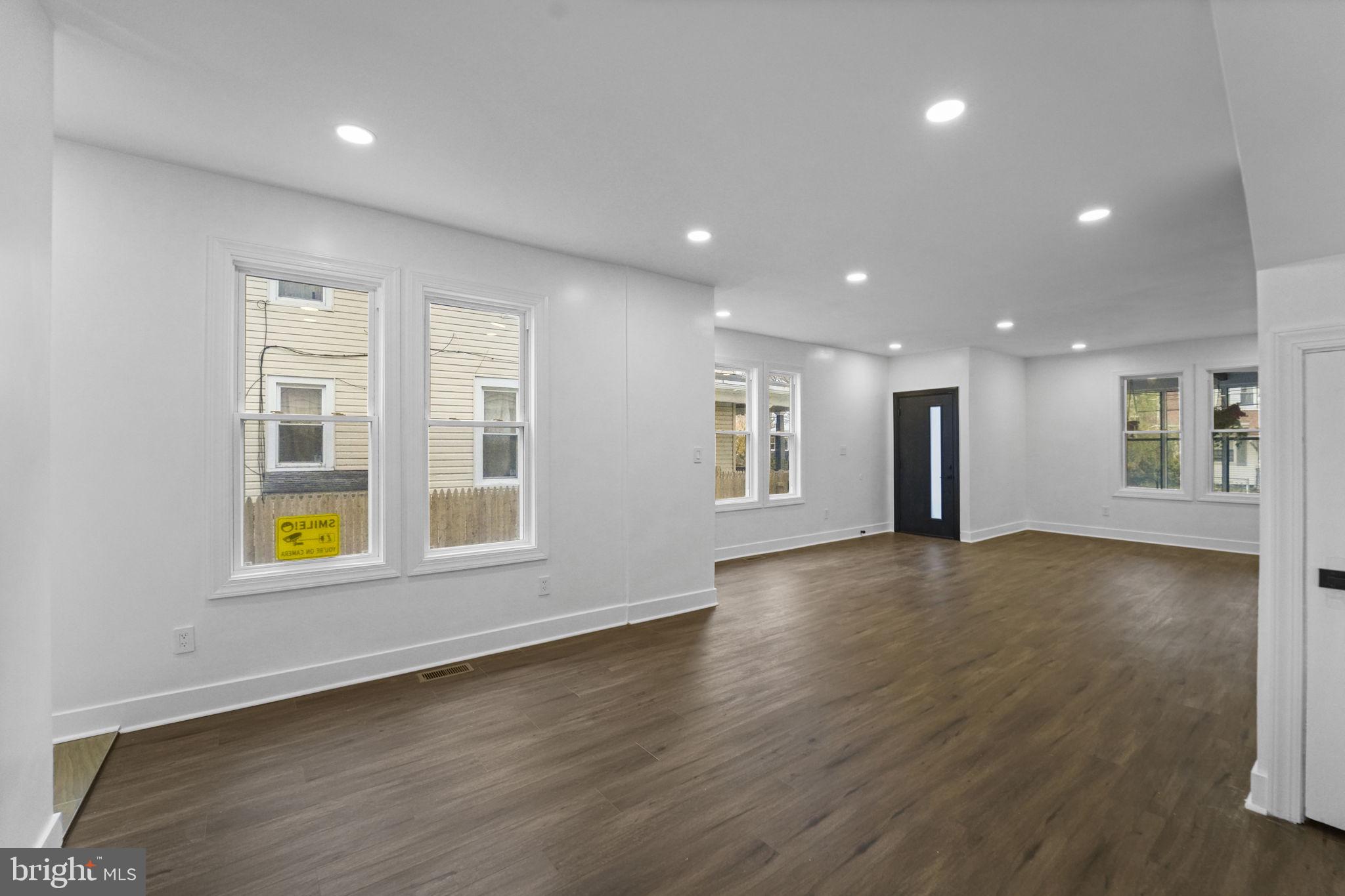 121 Parker Place Hamilton, NJ 08609 - Photo 11 of 37 an empty room with wooden floor and windows