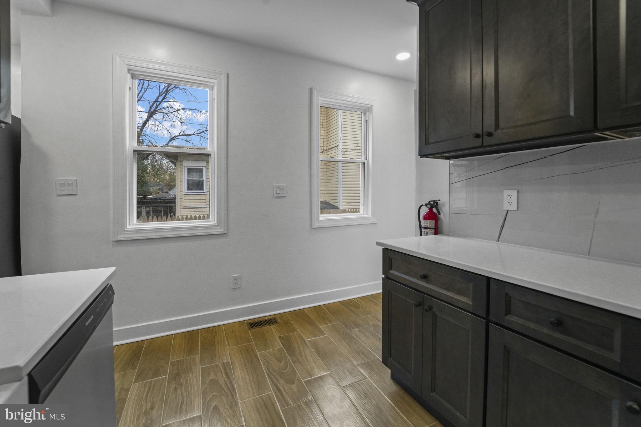 121 Parker Place Hamilton, NJ 08609 - Photo 15 of 37 a view of kitchen with wooden floor and cabinets