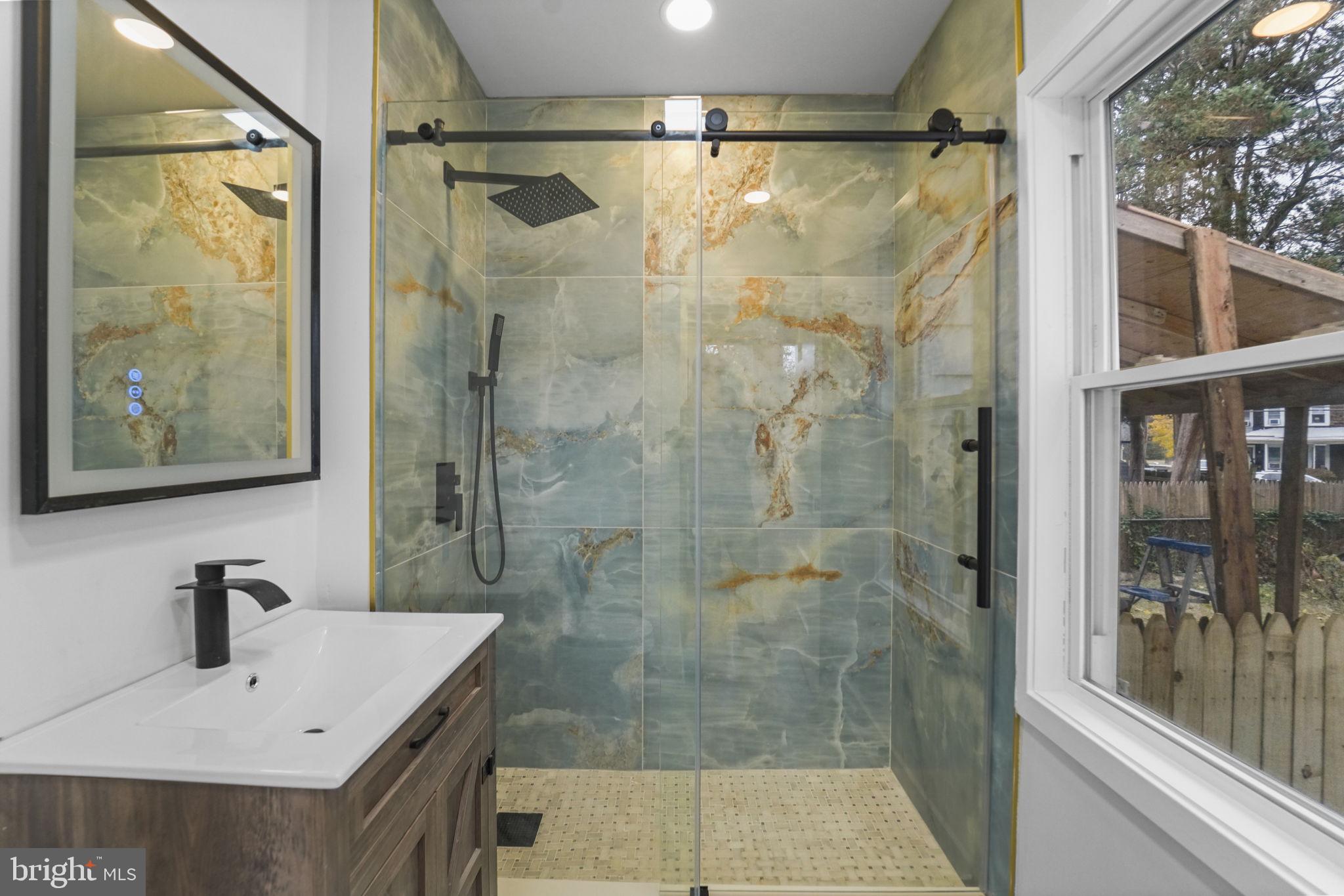 121 Parker Place Hamilton, NJ 08609 - Photo 17 of 37 a bathroom with a shower and sink