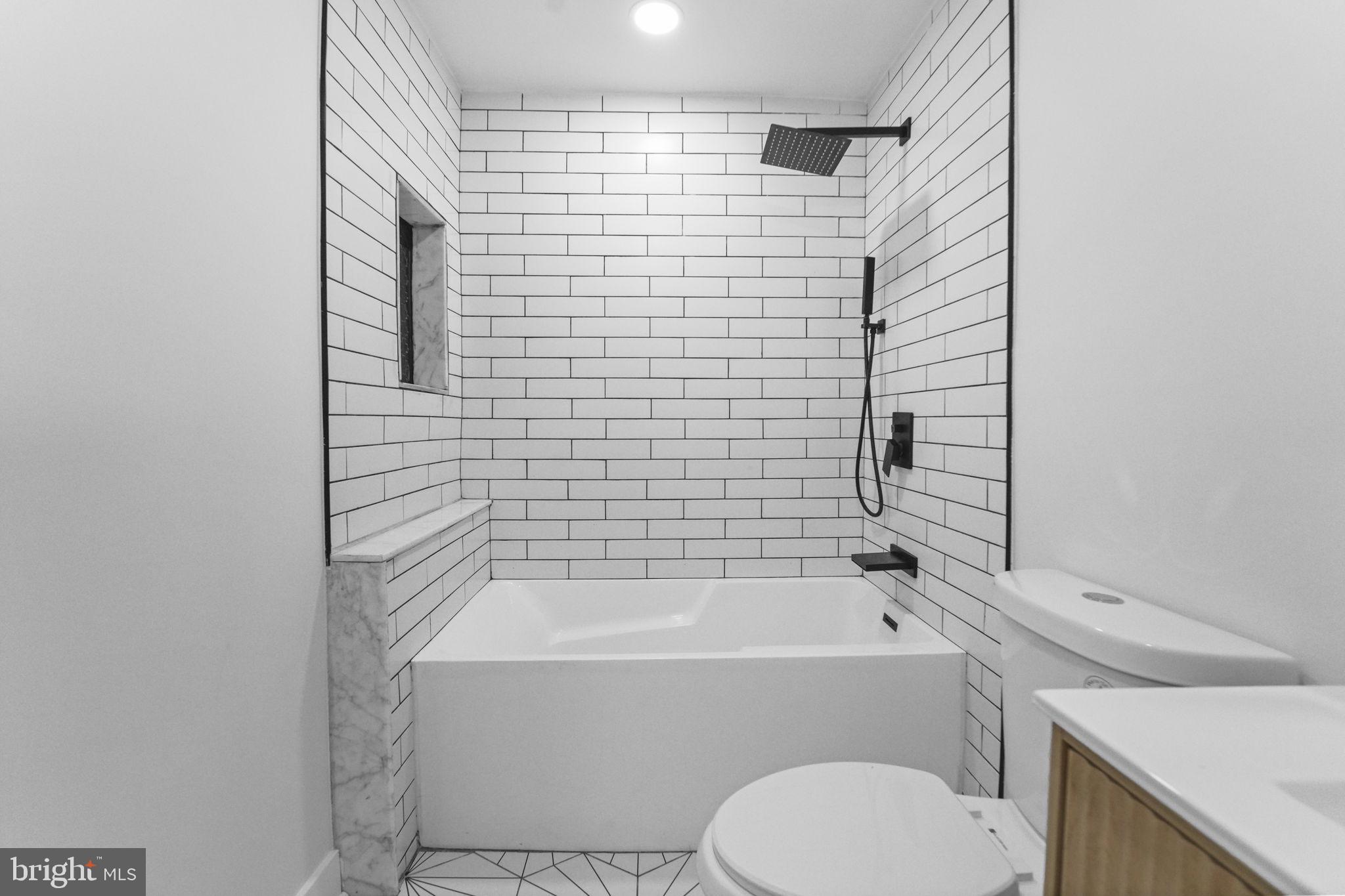121 Parker Place Hamilton, NJ 08609 - Photo 20 of 37 a bathroom with a bathtub and shower