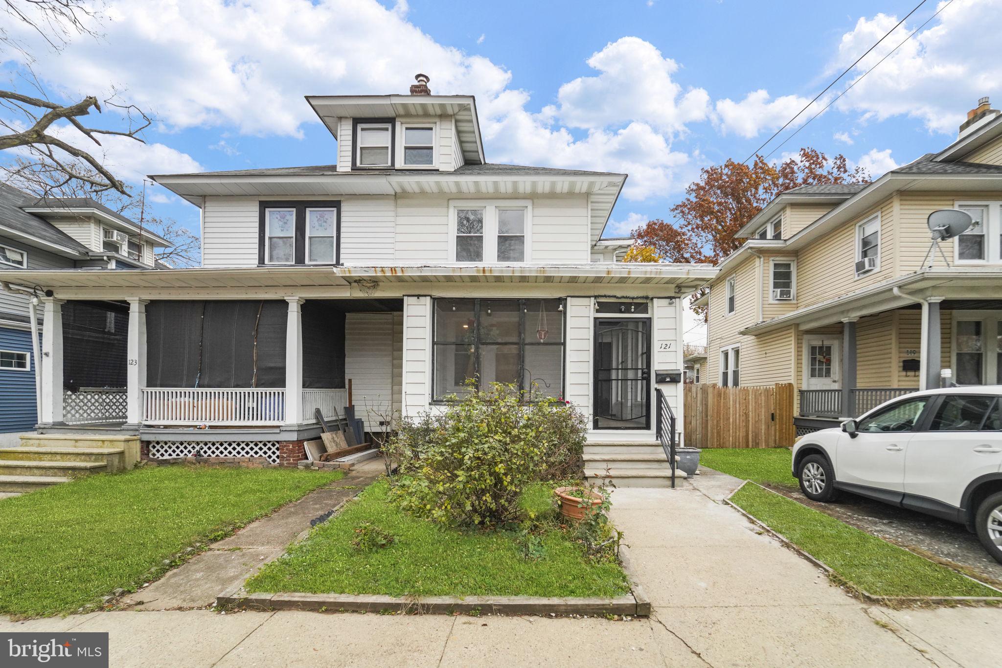 121 Parker Place Hamilton, NJ 08609 - Photo 2 of 37 a front view of a house with a yard