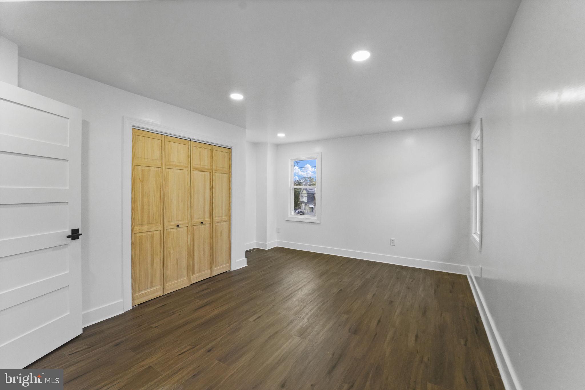 121 Parker Place Hamilton, NJ 08609 - Photo 22 of 37 wooden floor in an empty room with a window
