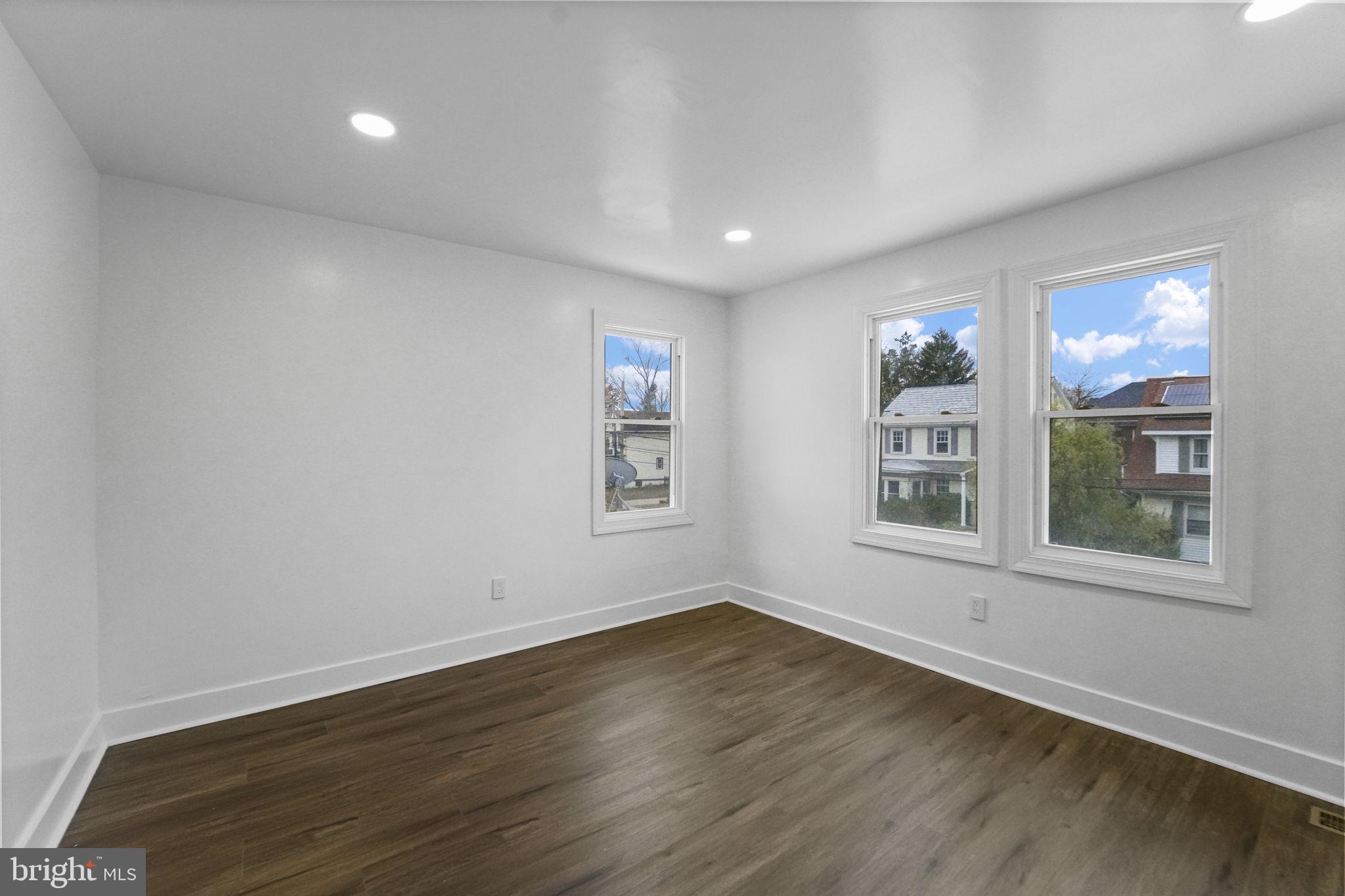 121 Parker Place Hamilton, NJ 08609 - Photo 26 of 37 a view of an empty room with a window and wooden floor