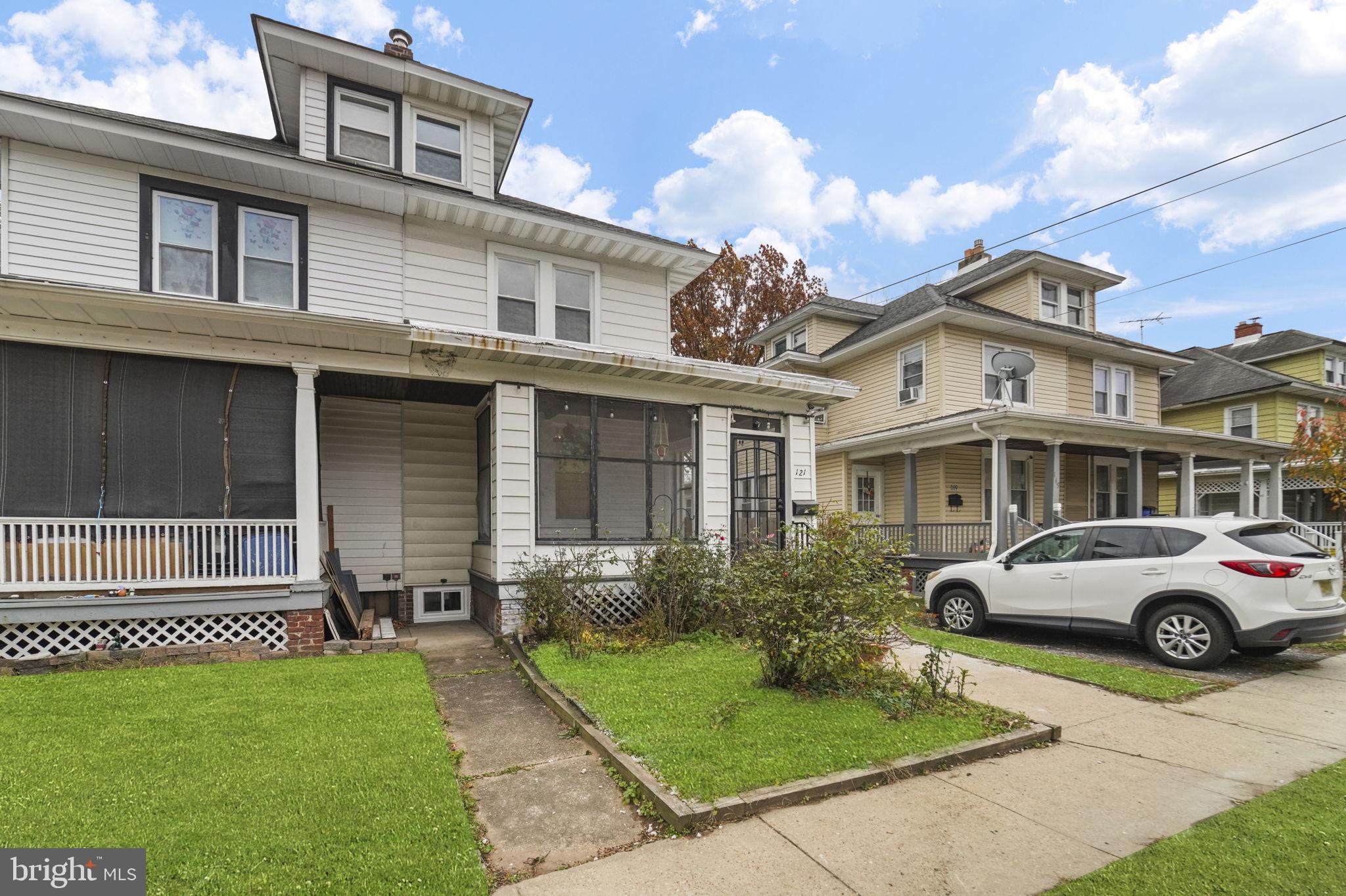 121 Parker Place Hamilton, NJ 08609 - Photo 3 of 37 a front view of a house with a garden