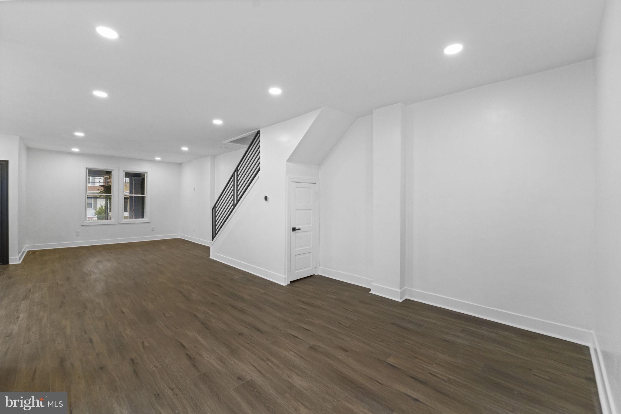 121 Parker Place Hamilton, NJ 08609 - Photo 6 of 37 an empty room with wooden floor and entryway