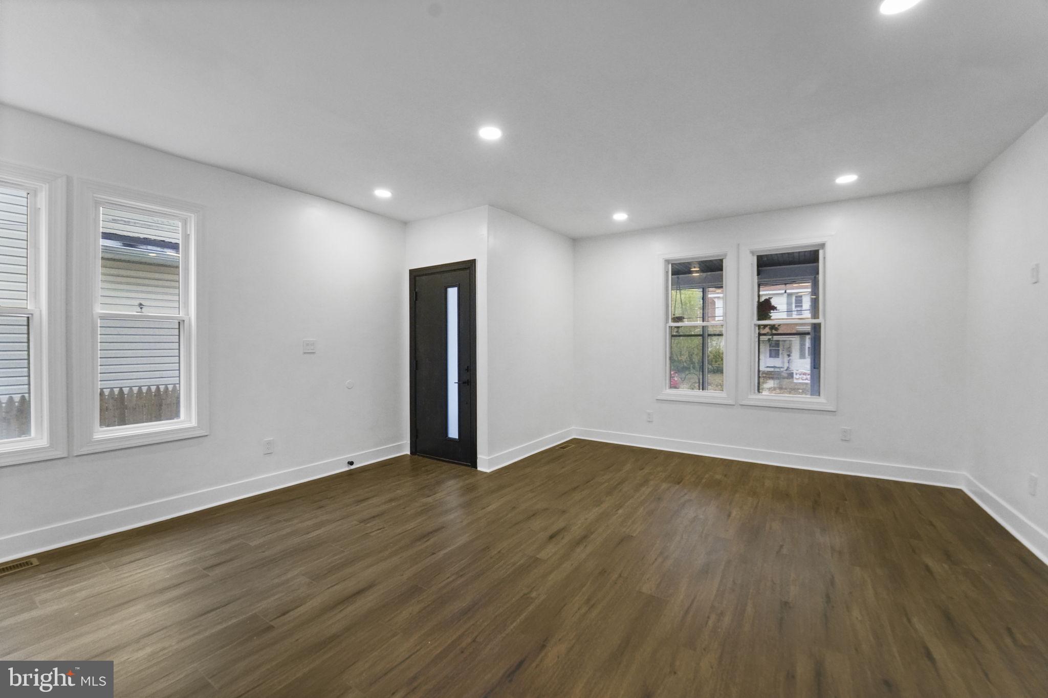 121 Parker Place Hamilton, NJ 08609 - Photo 10 of 37 a view of an empty room with wooden floor and a window